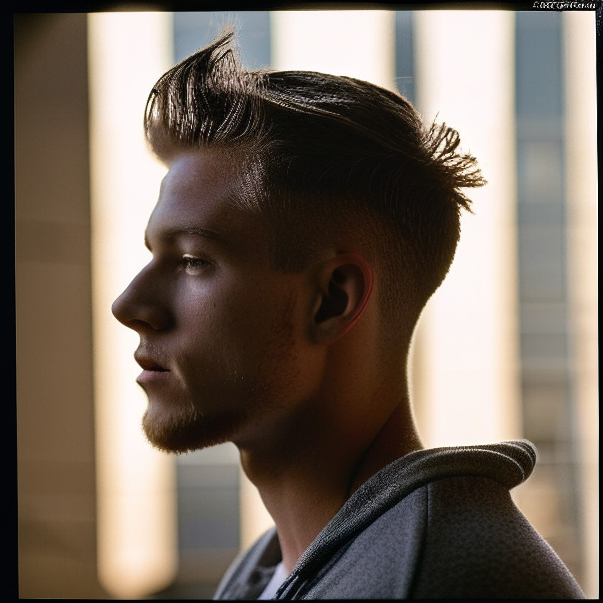 Check out this stylish low fade haircut! The subtle contrast between the short sides and longer top section creates a sophisticated look that's perfect for everyday wear. Whether you're looking to update your style or just want a fresh new 'do, this low fade haircut is definitely worth considering.