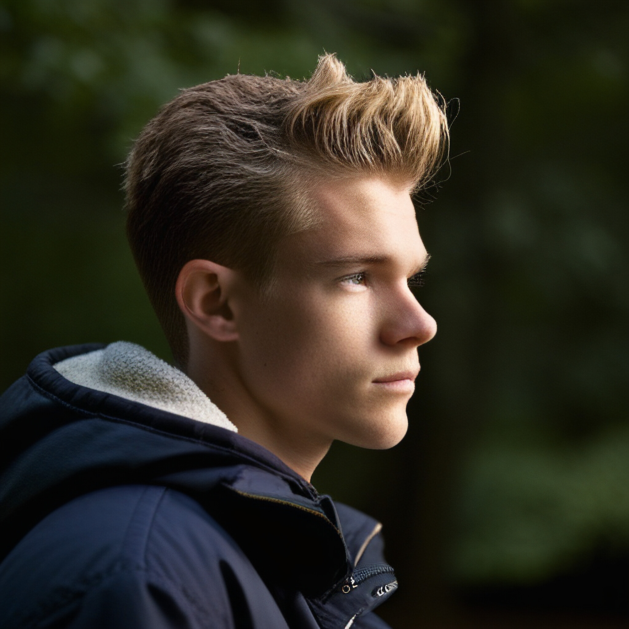 Take a closer look at this stunning example of a well-executed low fade haircut. The seamless blend of short sides and longer top hair creates a modern, sophisticated silhouette that's perfect for everyday wear or special occasions. With its clean lines, effortless charm, and attention to detail, this haircut is sure to inspire confidence in anyone who rocks it.