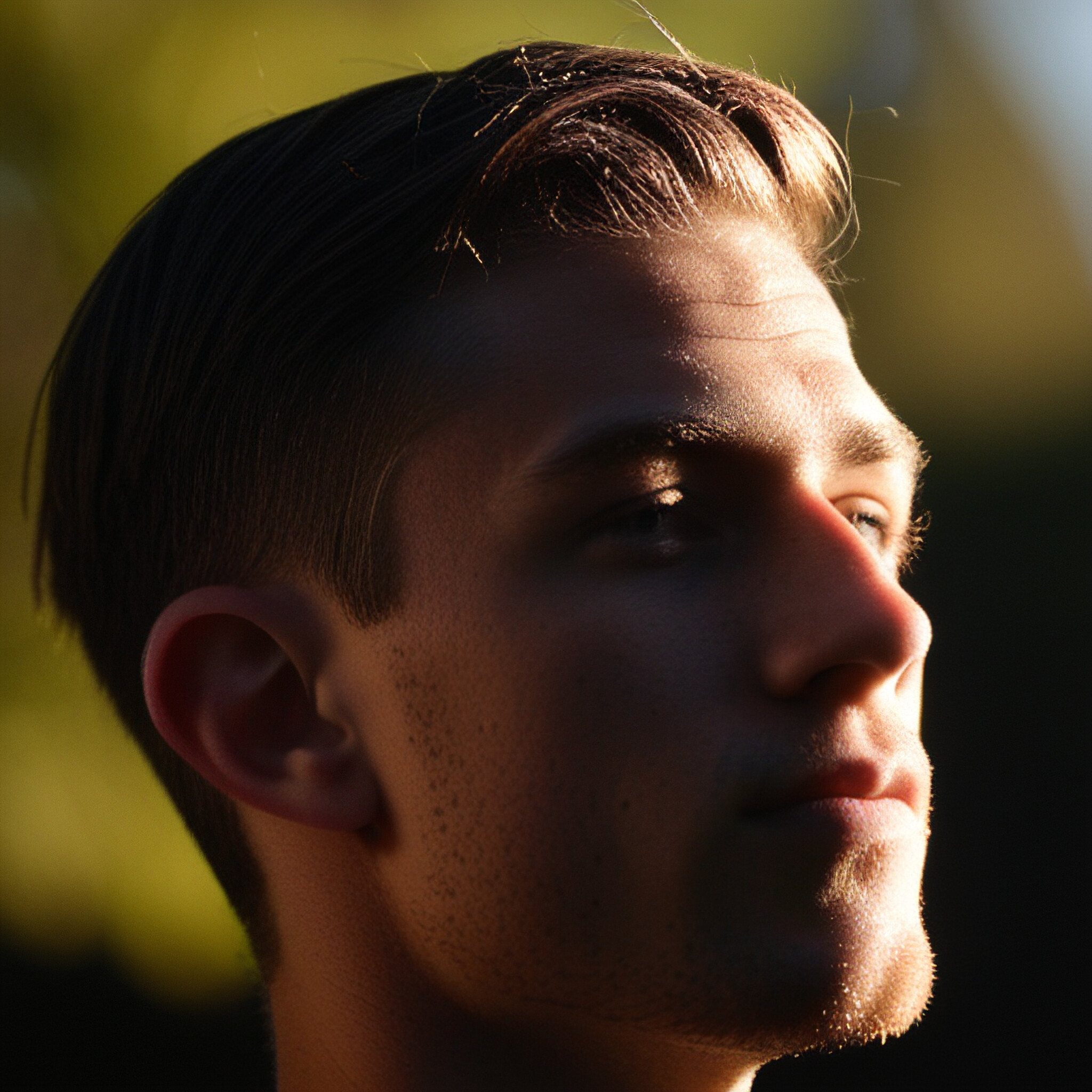 Get inspired by this young man's stylish short haircut, complete with an upswept texture that adds depth to his look.