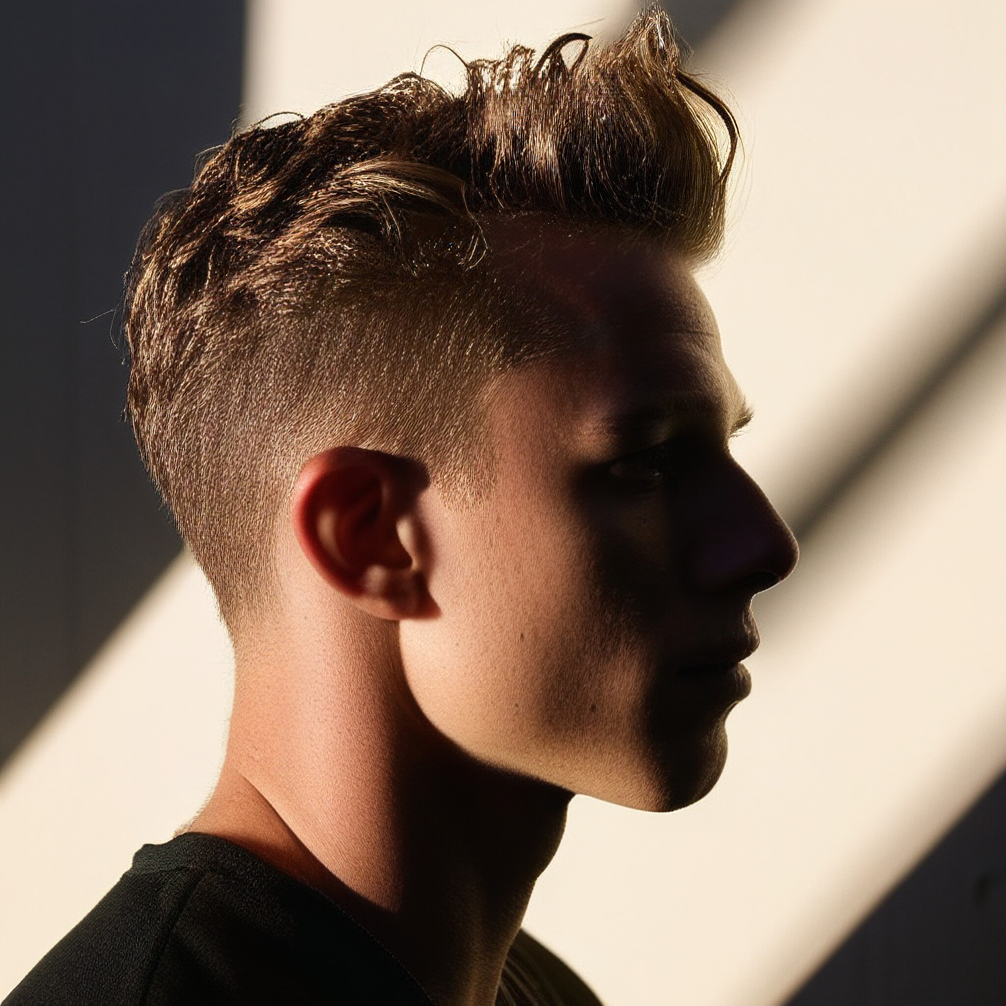 Say goodbye to bad hair days with this stunning low fade haircut. Perfect for busy men on-the-go, this style is easy to maintain and always looks great.