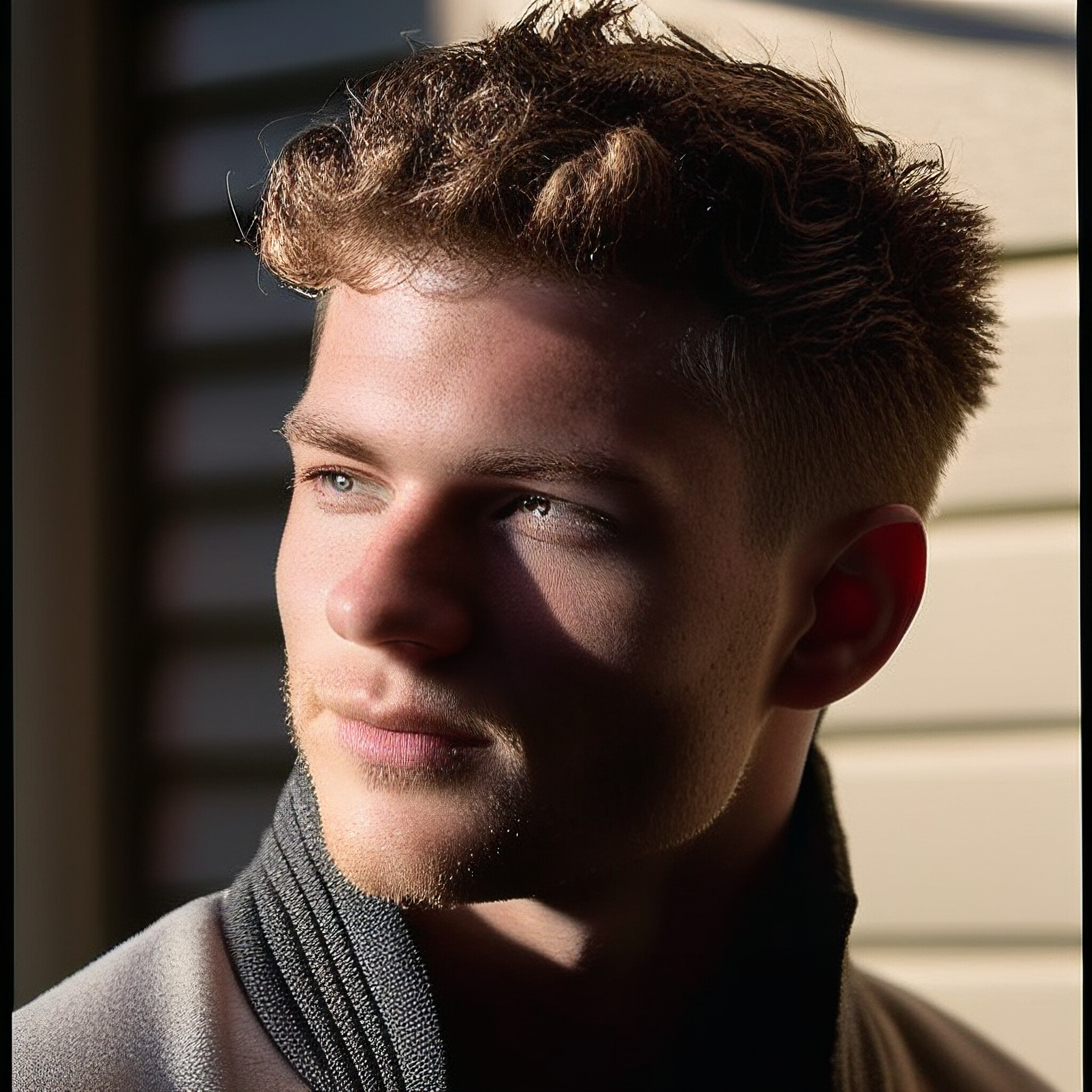 Experience the versatility of a low fade haircut! This style is perfect for those looking to update their grooming routine with a modern twist. The subtle gradient effect creates a seamless look, while the short top layer adds texture and visual interest. Try pairing it with a well-groomed beard or mustache for a complete transformation.